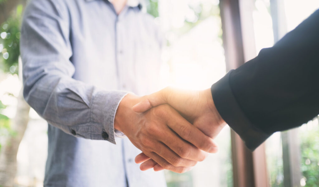 Successful businessmen hand shake. Business partnership meeting concept. Image businessmans handshake. Successful businessmen hand shake after good deal. Selectiive focus and Vintage effect .